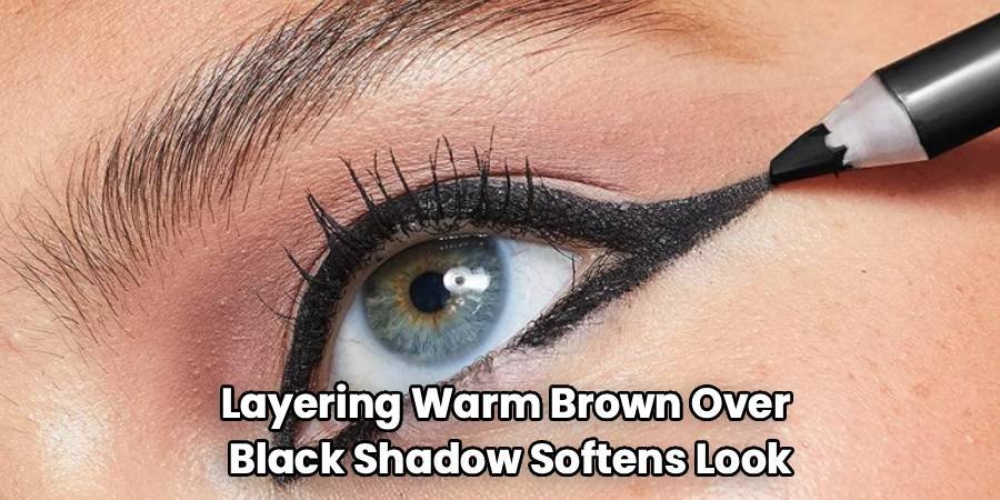 Layering Warm Brown Over
Black Shadow Softens Look