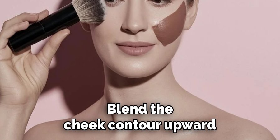 Blend the cheek contour upward